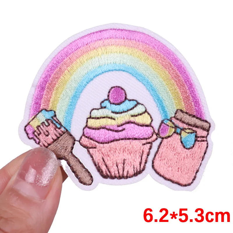 Colorful patch with a rainbow, cupcake, and jar held by a hand, with dimensions 6.2*5.3cm.