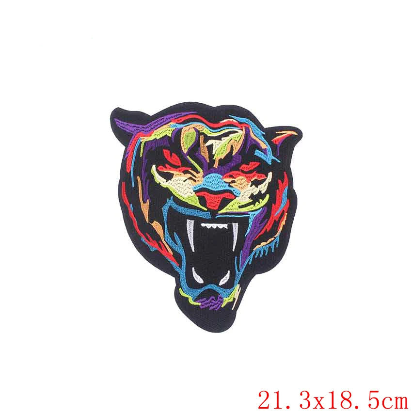 Colorful embroidered tiger patch with 'Prajna' branding on a white background