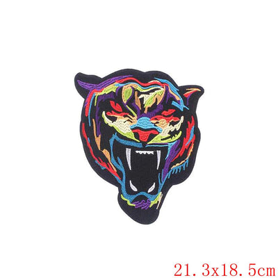 Colorful embroidered tiger patch with 'Prajna' branding on a white background