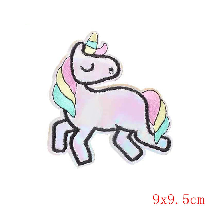 Colorful unicorn patch with rainbow mane and tail on a white background, branded &
