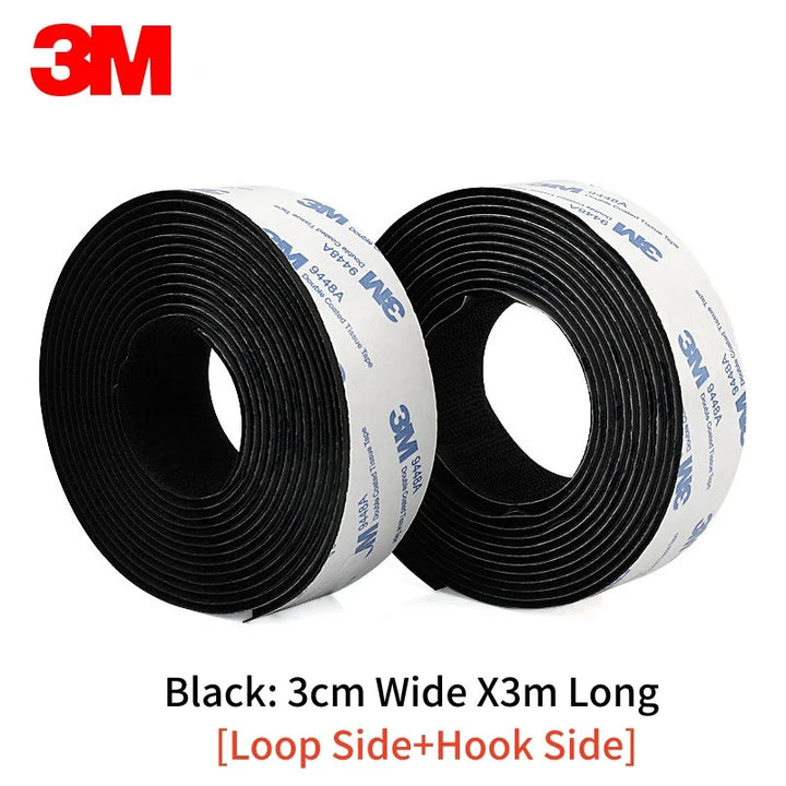 Two rolls of 3M black Velcro tape with specifications 3cm x 3meters on a white background