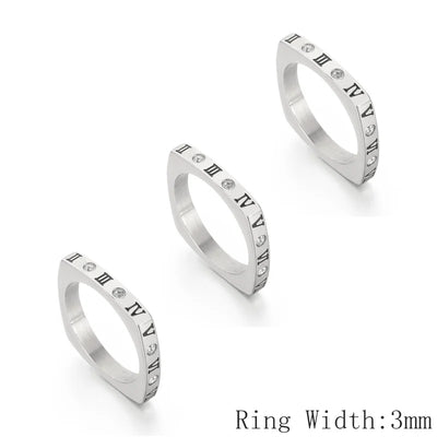 Three silver rings with Roman numeral accents on a white background