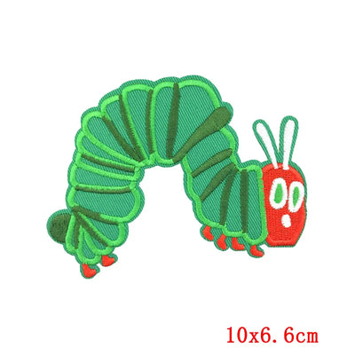 Embroidered green caterpillar patch with a red face on a white background