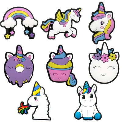 Set of colorful unicorn-themed shoe charms on a white background
