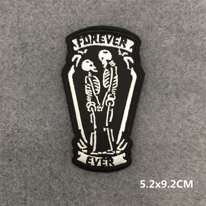 Patch with skeleton couple in a coffin and &