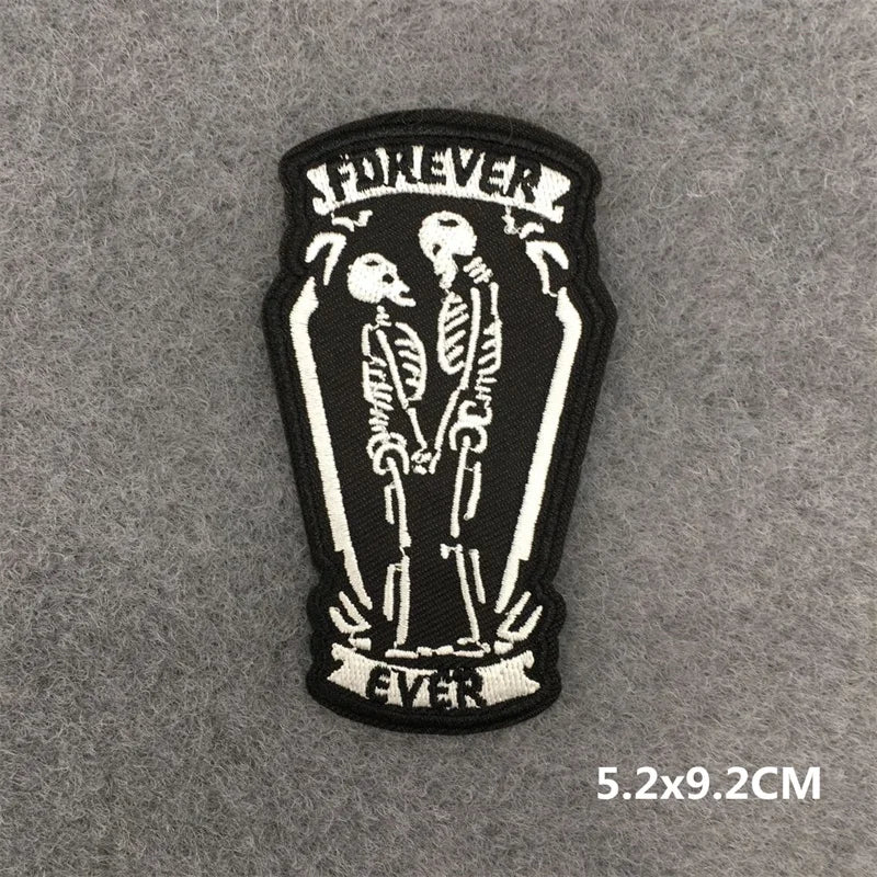 Patch with skeleton couple in a coffin and 'Forever Ever' text on a gray background