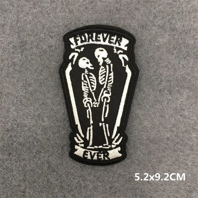 Patch with skeleton couple in a coffin and 'Forever Ever' text on a gray background