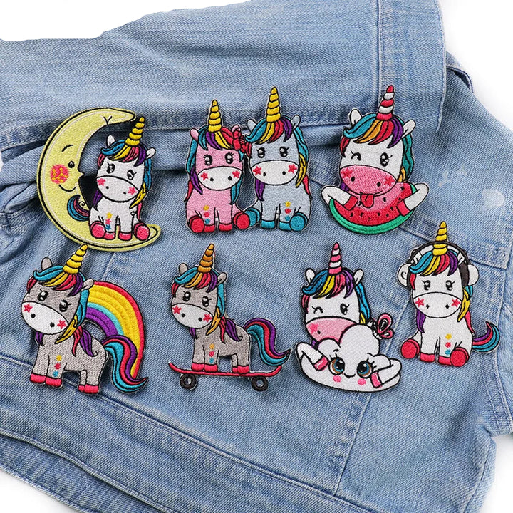 Colorful unicorn patches on a denim background