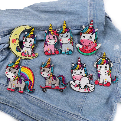Colorful unicorn patches on a denim background