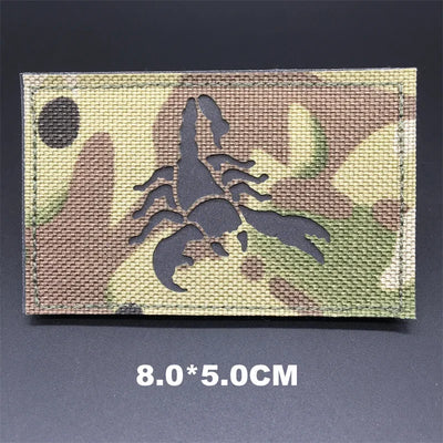 Multicam patterned patch with a scorpion design on a dark background