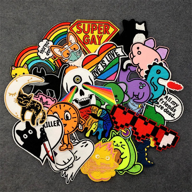 Collection of colorful patches with various designs on a dark background