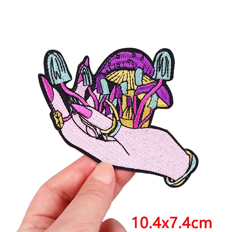 Colorful hand with mushrooms patch held by a hand, size 10.4x7.4cm