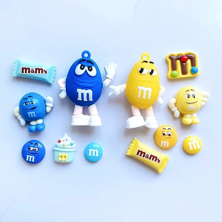 Colorful M&amp;M character figurines on a light blue background