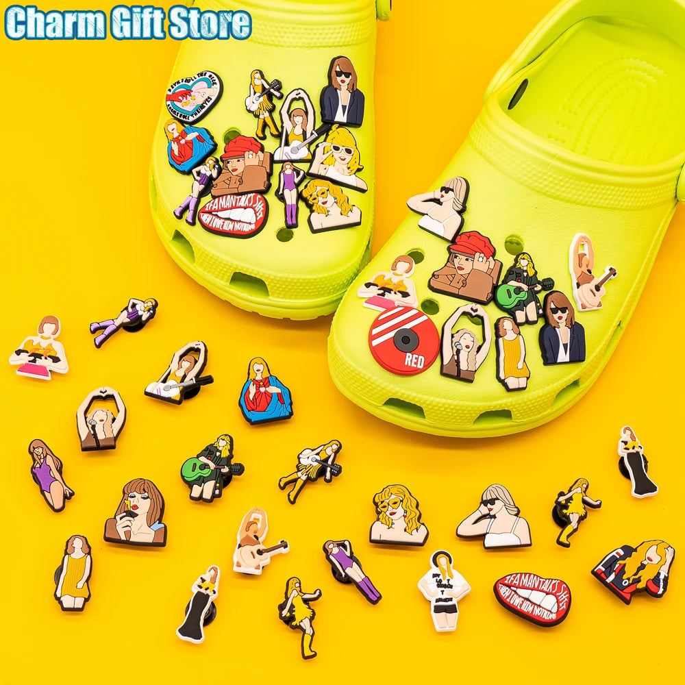 Yellow clogs with various charms on a yellow background, labeled &