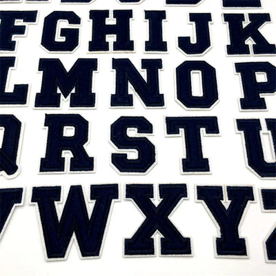 Navy blue letter stickers arranged in a grid on a white background