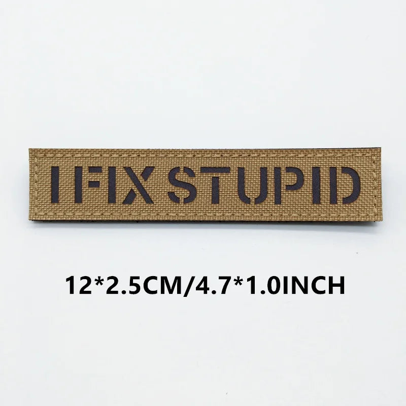 Rectangular patch with 'I FIX STUPID' text on a white background