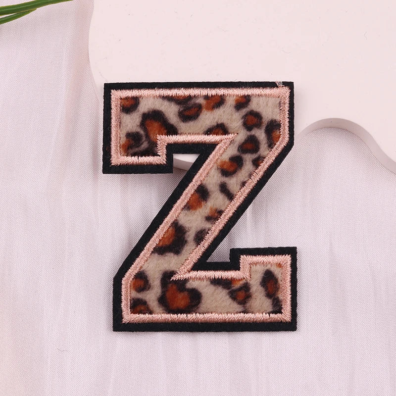 Leopard print letter 'Z' patch on a light fabric background