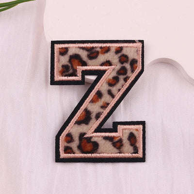 Leopard print letter 'Z' patch on a light fabric background