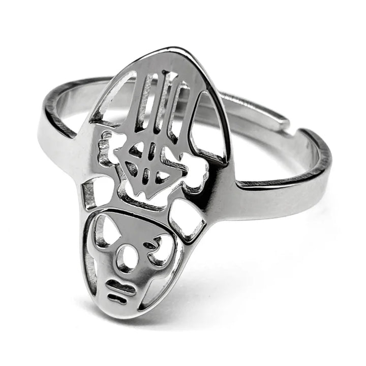 Silver ring featuring an abstract, tribal mask design with cutout details. The ring has a smooth, polished finish and modern, artistic style.