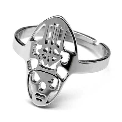Silver ring featuring an abstract, tribal mask design with cutout details. The ring has a smooth, polished finish and modern, artistic style.