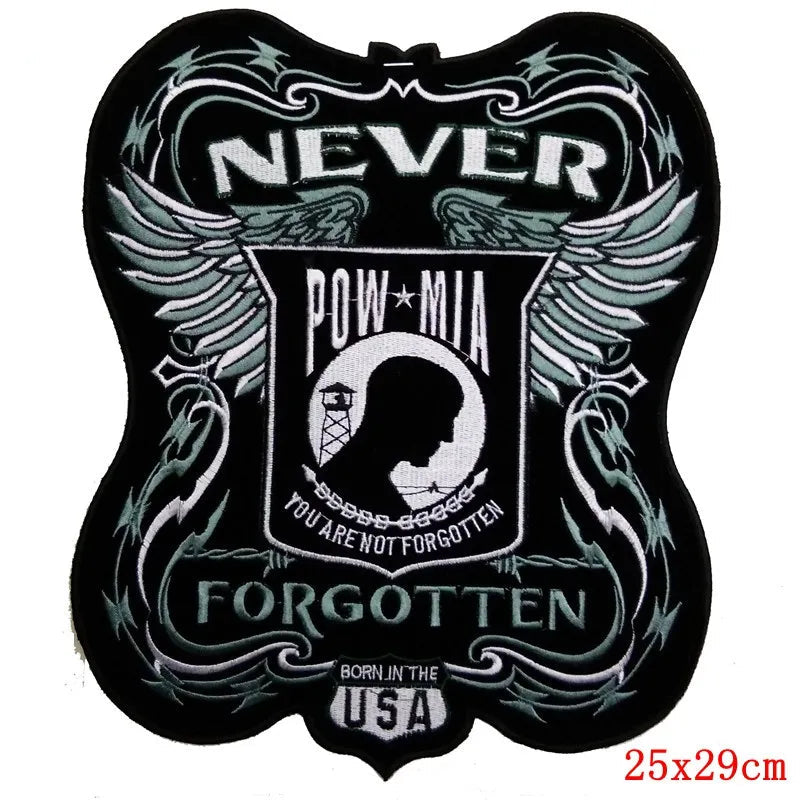 Decorative patch with 'Never Forgotten' and POW/MIA emblem on a black background