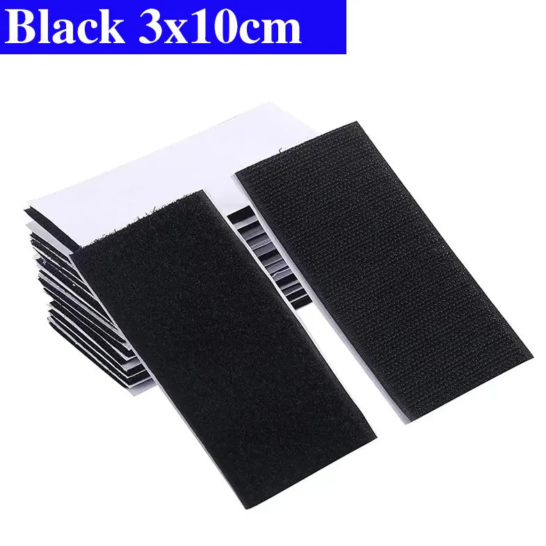 Black adhesive Velcro patches with dimensions 3x10cm on a white background