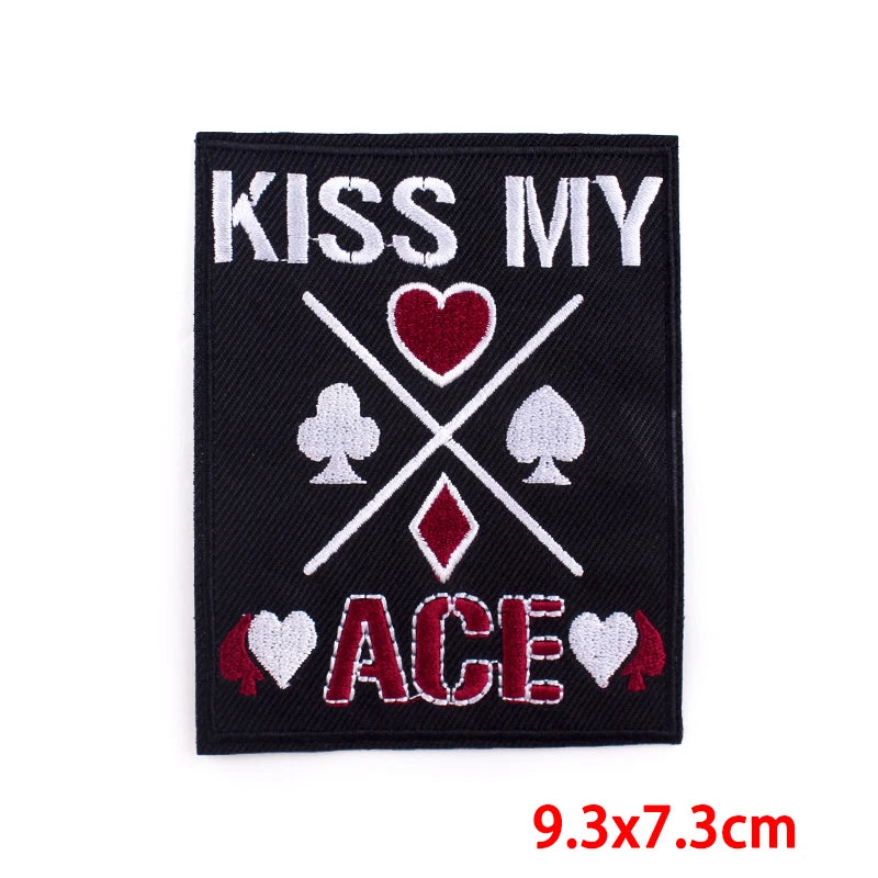 Embroidered patch with 'Kiss My Ace' text and card suit symbols on a black background.