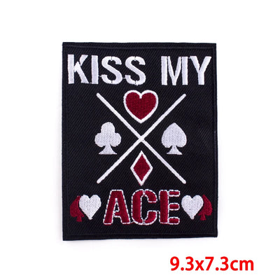 Embroidered patch with 'Kiss My Ace' text and card suit symbols on a black background.