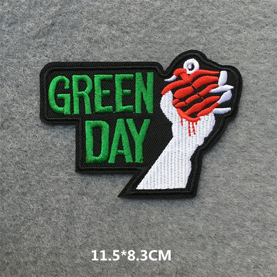 Embroidered patch with 'Green Day' logo on a gray background
