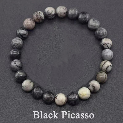 Beaded bracelet labeled 'Black Picasso' on a dark gray background