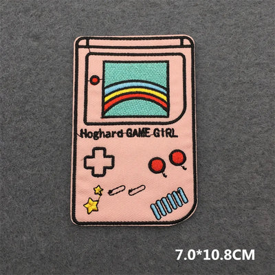 Patch of a retro game console with rainbow design on a gray background