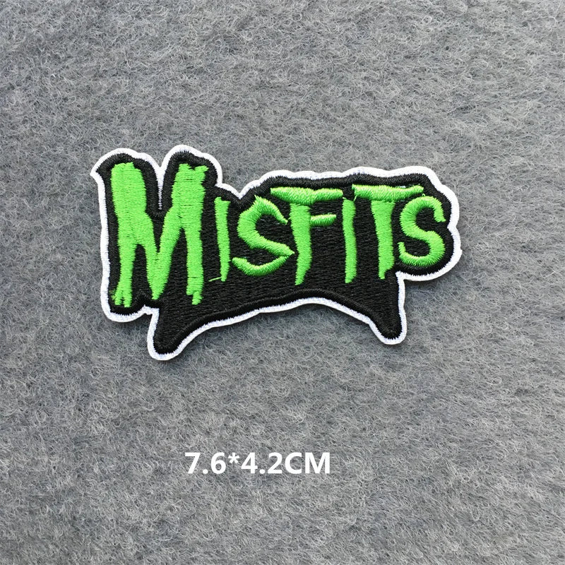 Embroidered patch with 'Misfits' text in green on a gray background