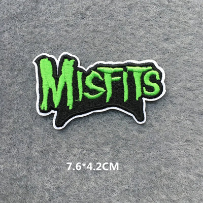 Embroidered patch with 'Misfits' text in green on a gray background