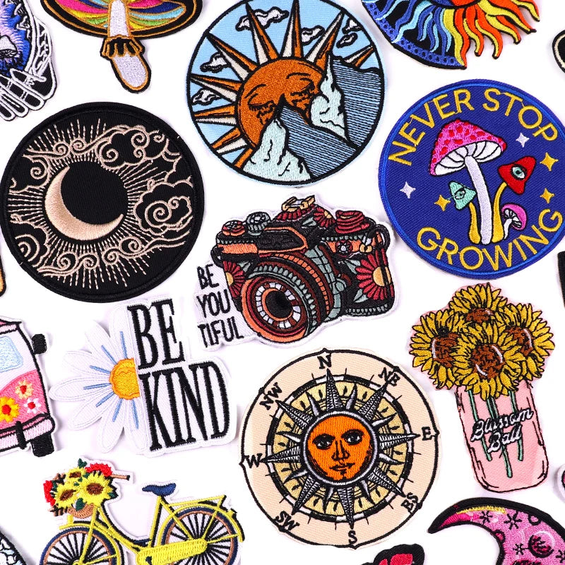 Collection of various colorful patches with different designs on a white background.