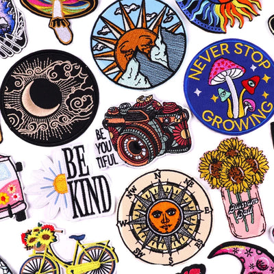 Collection of various colorful patches with different designs on a white background.