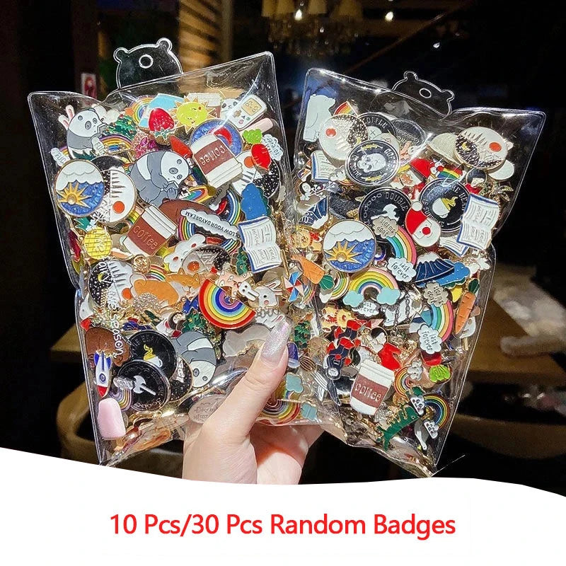 Two clear plastic bags filled with colorful badges held by a hand, with text indicating quantity.