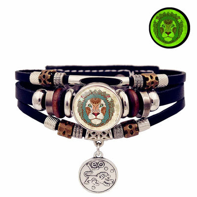 Multistrand bracelet with lion-themed charms on a white background