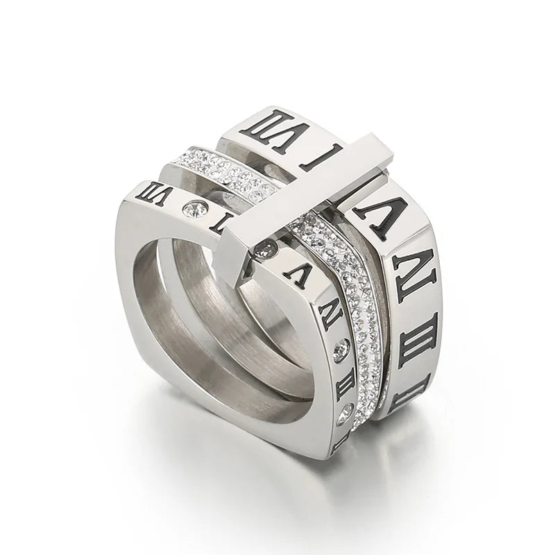 Silver ring with Roman numeral design on a white background