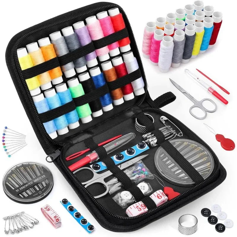 Sewing kit with colorful threads, scissors, and other tools on a white background