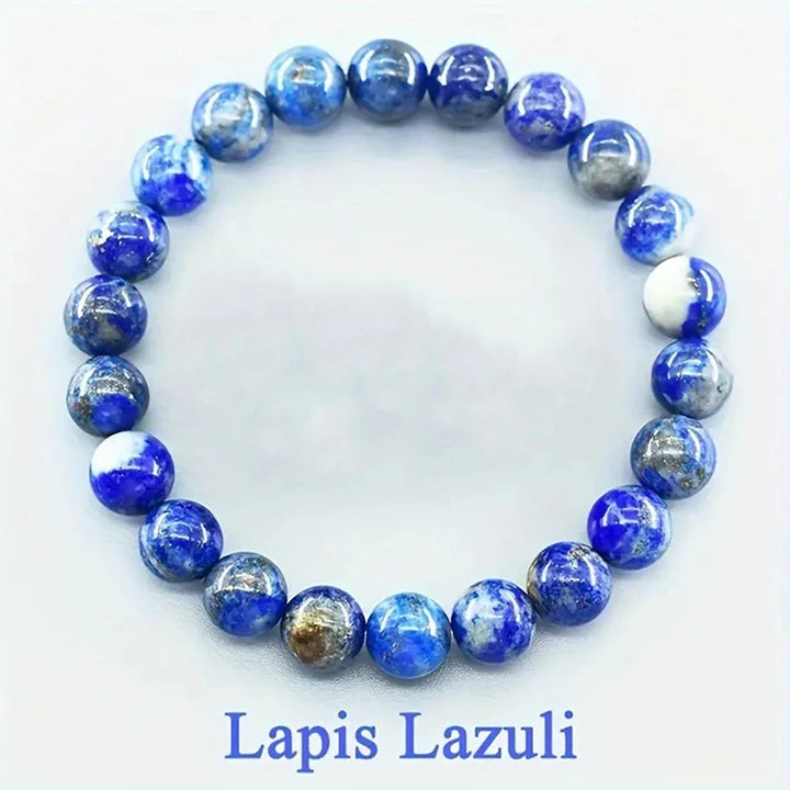 Lapis Lazuli beaded bracelet on a white background with &