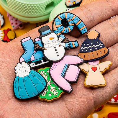 Colorful Christmas-themed shoe pins on a hand with a blurred background