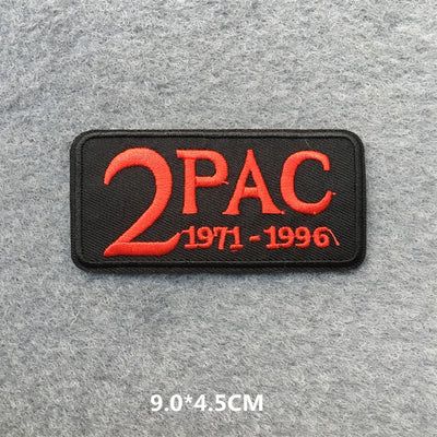 Embroidered patch with '2PAC' and years on a gray background
