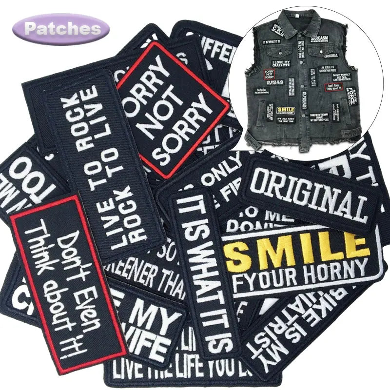 Collection of text patches with a vest featuring more patches in the corner.