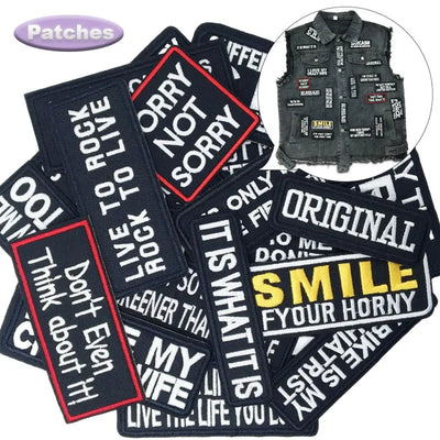 Collection of text patches with a vest featuring more patches in the corner.