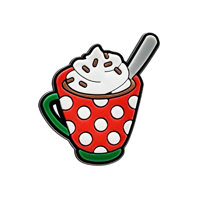Shoe charm ornament of a red polka dot mug with whipped cream and a spoon on a white background