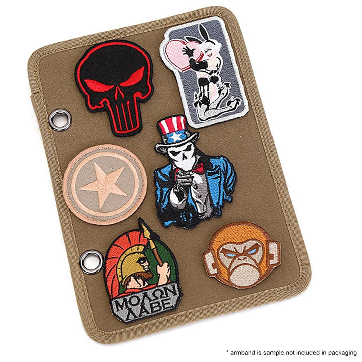 Collection of various patches on a brown Tactical patch display panel on a white background