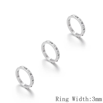 Three silver rings with Roman numeral engraving on a white background