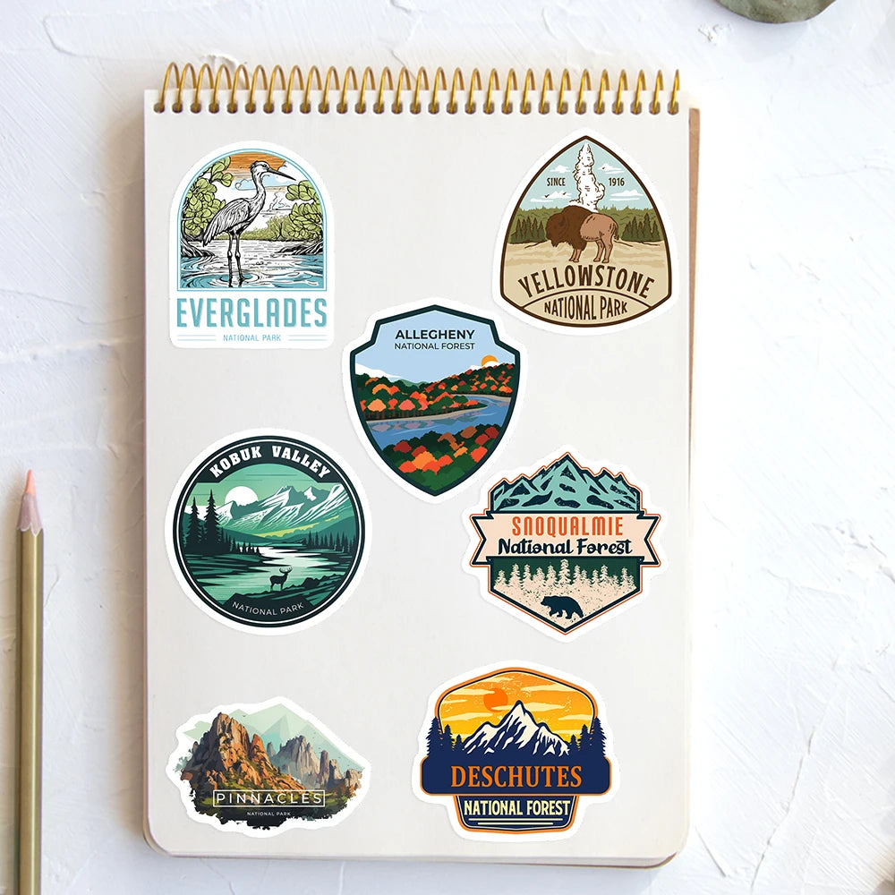Notebook with national park stickers on a white surface