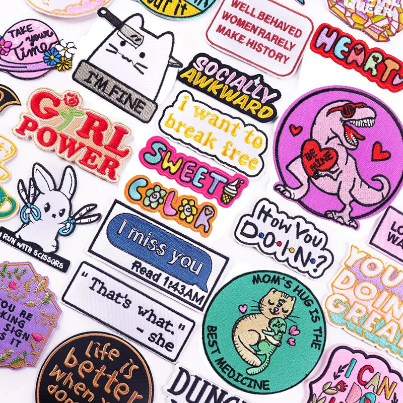 Collection of colorful stickers with various designs and text on a white background
