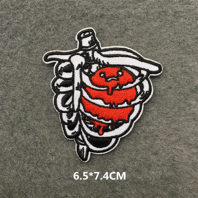 Embroidered patch with a design of a bottle and red heart on a gray background, with size measurement '6.5*7.4CM'.